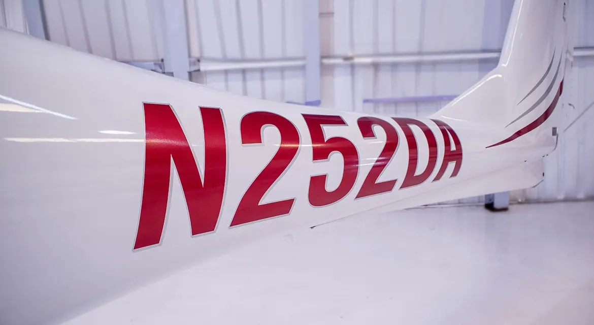 A close up of the number 2 5 2 days on a plane